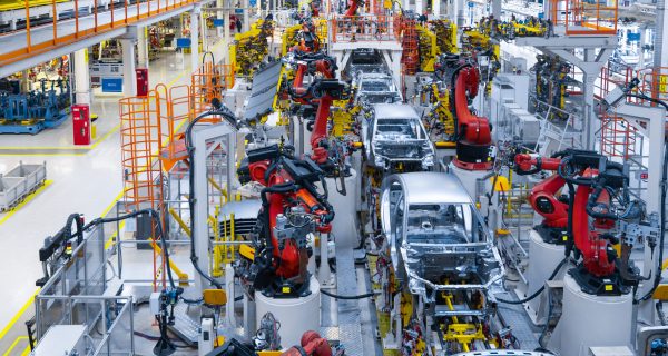 Assembly line production of new car. Automated welding of car body on production line. robotic arm on car production line is working